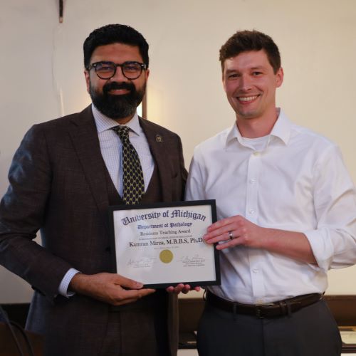Dr. Kamran Mirza was presented with the Residents Teaching Award by Dr. Andrew Valesano.
